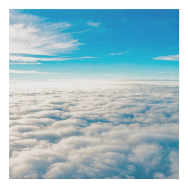 Sunrise above clouds from airplane window faux canvas print (Front)