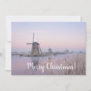Sunrise and windmills in winter christmas card
