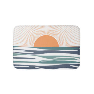 Sunrise by the sea bath mat