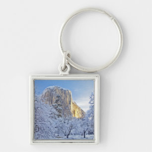Sunrise light hits El Capitan through snowy Keychain