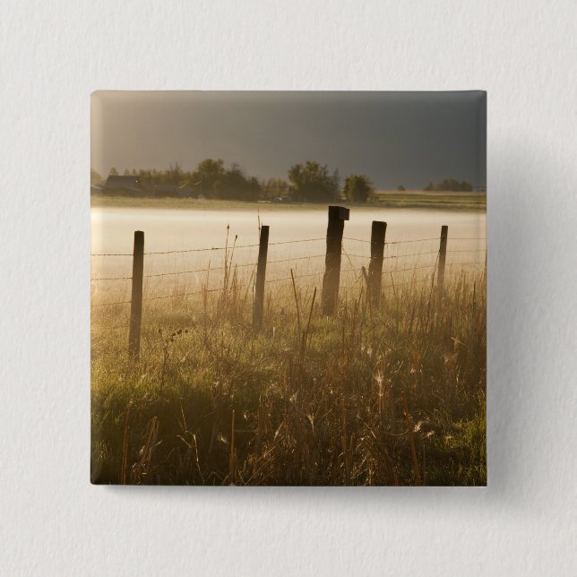 Sunrise lights fog along fence near Charlo Button (Front)