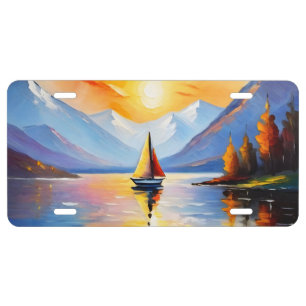 Sunrise over a lake and snow capped mountains license plate