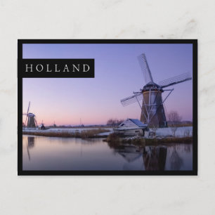 Sunrise over dutch windmills edge postcard