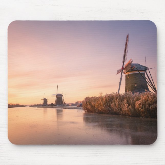 Sunrise over frozen river with windmills and reeds mouse pad (Front)
