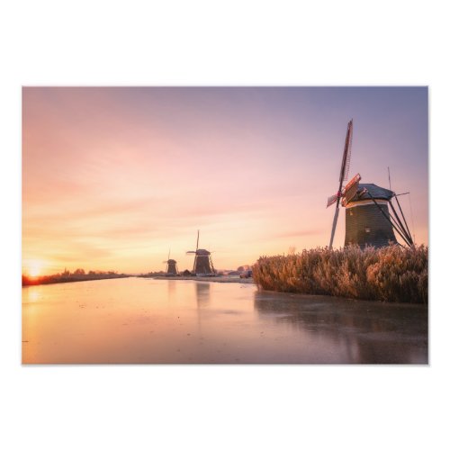 Sunrise over frozen river with windmills and reeds photo print