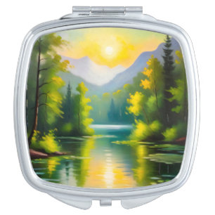 Sunrise over snow covered mountains and lake compact mirror
