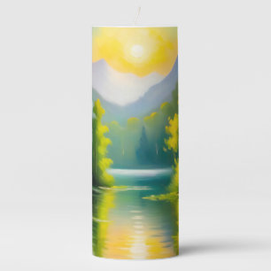 Sunrise over snow covered mountains and lake pillar candle