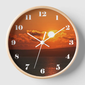 Sunrise over the sea clock