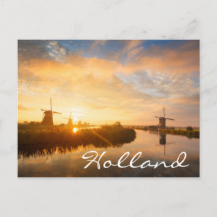Sunrise over windmills and a river in Holland Postcard