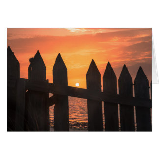 Sunrise through A fence Cards