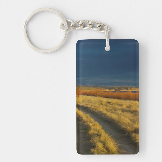 Sunset highlights the red bark of bushes keychain (Front)