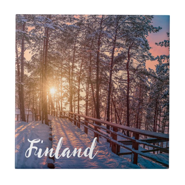 Sunset in snowy pine forest with sun ray ceramic tile (Front)