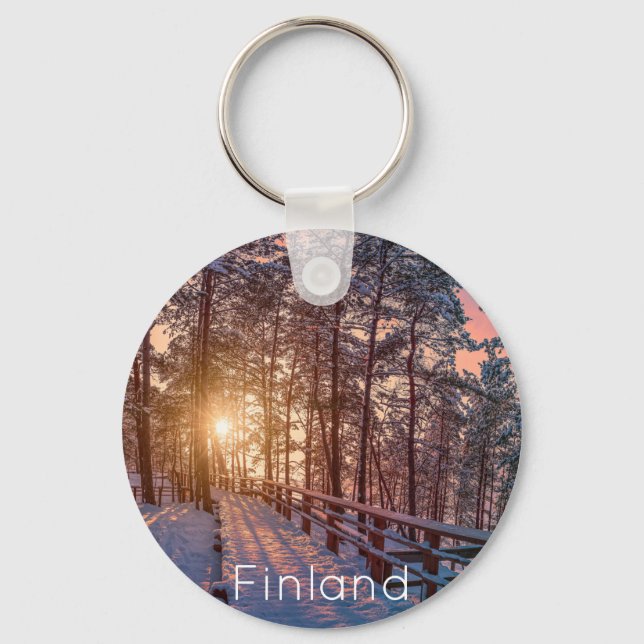 Sunset in snowy pine forest with sun ray keychain (Front)