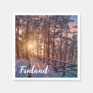 Sunset in snowy pine forest with sun ray napkins