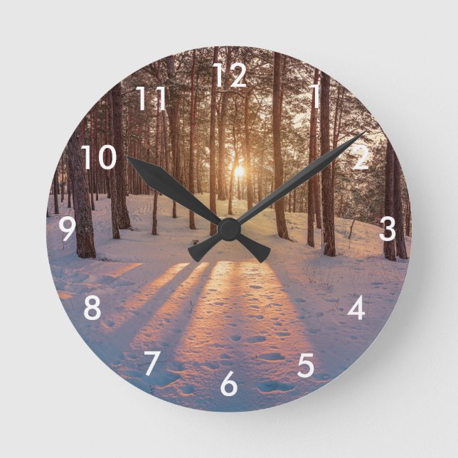 Sunset in snowy winter pine forest round clock (Front)
