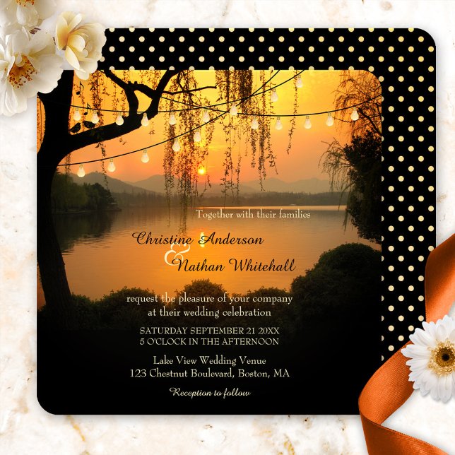 Sunset Lake View String Lights Wedding Invitation (Romantic wedding invitation featuring a sunset at a lake with festive string lights and love birds)