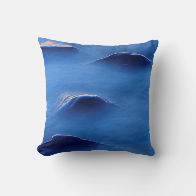 Sunset on rocks protruding through foamy water throw pillow (Front)