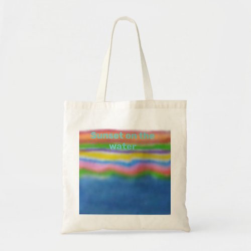 sunset on the water tote bag