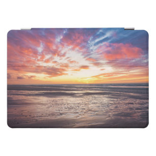 Sunset over beach and sea iPad pro cover