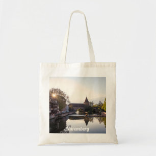 Sunset over old medieval bridge in Nuremberg Tote Bag