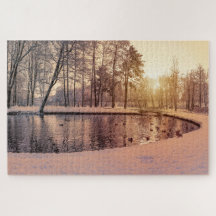 Sunset over park with small frosty lake