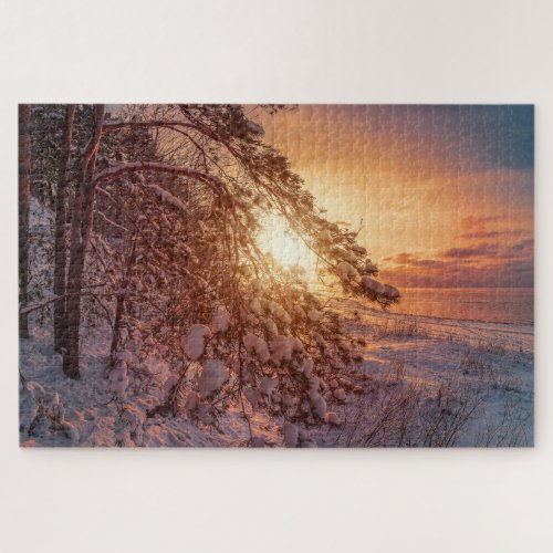 Sunset over sea and snowy pine tree jigsaw puzzle