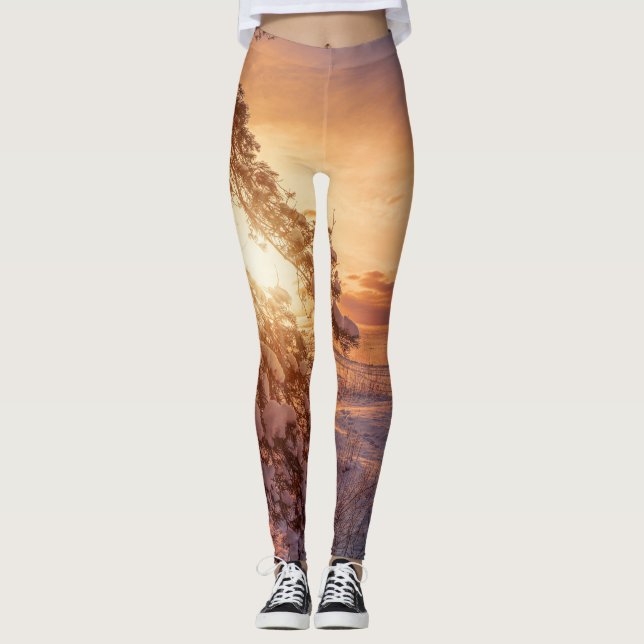 Sunset over sea and snowy pine tree leggings (Front)