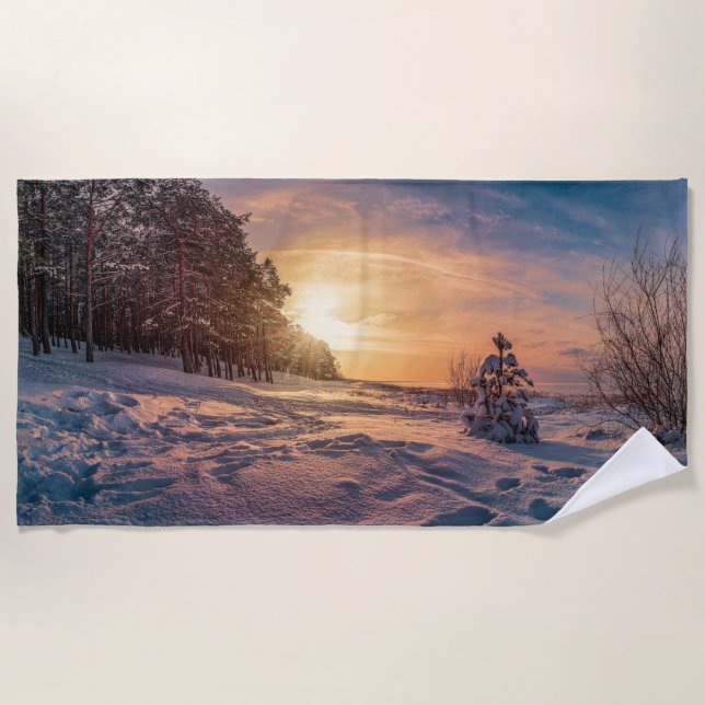 Sunset over snowy winter sea coast beach towel (Front)