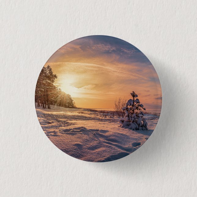 Sunset over snowy winter sea coast button (Front)
