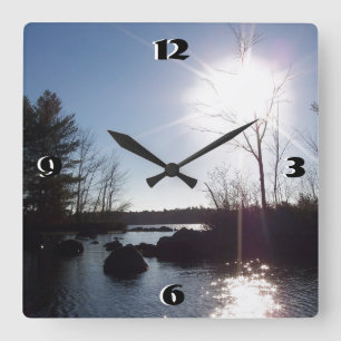 Sunset over the lake square wall clock