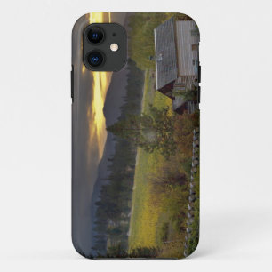 Sunset sky over vineyards and historic log cabin iPhone 11 case