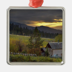 Sunset sky over vineyards and historic log cabin metal ornament
