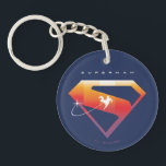 Sunset Soar Superman Shield Keychain<br><div class="desc">Add a cosmic twist to your superhero style with this radiant Superman design! Set against a deep navy backdrop, the classic “S” shield glows in a warm gradient of fiery orange, golden yellow, and sunset pink—capturing the beauty of Superman’s power and hope. A silhouette of Superman streaks across the emblem...</div>