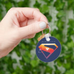 Sunset Soar Superman Shield Keychain<br><div class="desc">Add a cosmic twist to your superhero style with this radiant Superman design! Set against a deep navy backdrop, the classic “S” shield glows in a warm gradient of fiery orange, golden yellow, and sunset pink—capturing the beauty of Superman’s power and hope. A silhouette of Superman streaks across the emblem...</div>