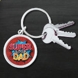 Super Dad Mustache Modern Grunge Keychain<br><div class="desc">Super Dad Mustache Modern Grunge Keychain features the text "Super Dad" in modern red and yellow typography on a blue and red grunge background accented with a mustache. Gifts for Dad for birthday,  Father's Day,  Christmas,  holidays and more. Created by Evco Studio www.zazzle.com/store/evcostudio</div>