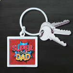 Super Dad Mustache Modern Grunge Keychain<br><div class="desc">Super Dad Mustache Modern Grunge Keychains features the text "Super Dad" in modern red and yellow typography on a blue and red grunge background accented with a mustache. Gifts for Dad for birthday,  Father's Day,  Christmas,  holidays and more. Created by Evco Studio www.zazzle.com/store/evcostudio</div>