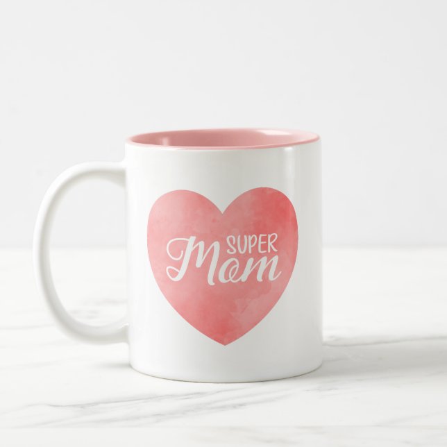 Super Mom text in pink painted heart Two-Tone Coffee Mug (Left)