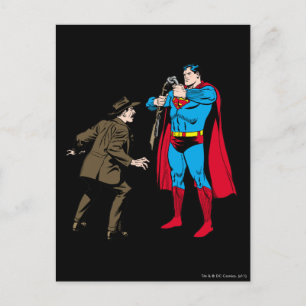 Superman bends a gun postcard