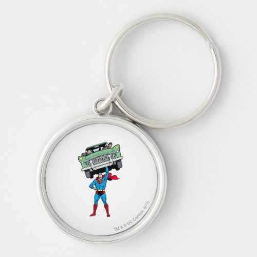 Superman holds a car keychain