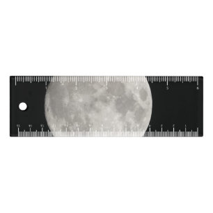 Supermoon in black sky ruler