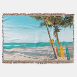 Surf boards on beach throw pillow blanket