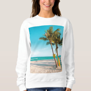 Surf boards on beach throw pillow sweatshirt