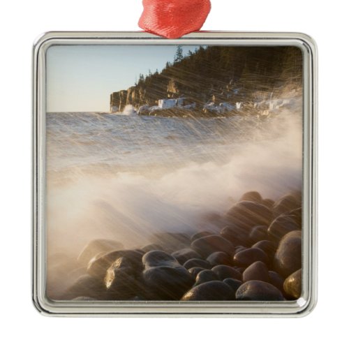 Surf washes over the cobblestones in Monument Metal Ornament
