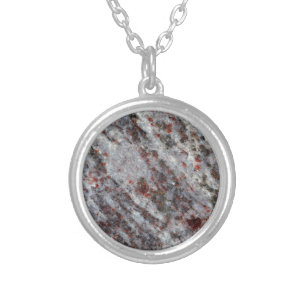 Surface of a gneiss rock with garnets silver plated necklace