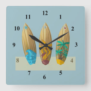 Surfboards on the sand square wall clock