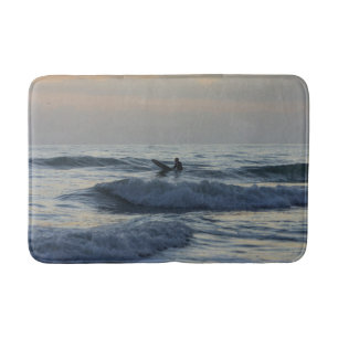 Surfer Awaits Bathroom Mat