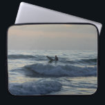 Surfer Awaits Laptop Sleeve<br><div class="desc">A surfer patiently waits for the perfect wave as he enjoys the first dawn / sunrise of 2017. I took this from Cocoa Beach, Florida. Looking for more prints or products? Feel free to visit my store: http://www.zazzle.com/timelessmomentsphtgy This photo was taken by Jennifer White with Timeless Moments Photography. All images...</div>