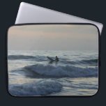 Surfer Awaits Laptop Sleeve<br><div class="desc">A surfer patiently waits for the perfect wave as he enjoys the first dawn / sunrise of 2017. I took this from Cocoa Beach, Florida. Looking for more prints or products? Feel free to visit my store: http://www.zazzle.com/timelessmomentsphtgy This photo was taken by Jennifer White with Timeless Moments Photography. All images...</div>
