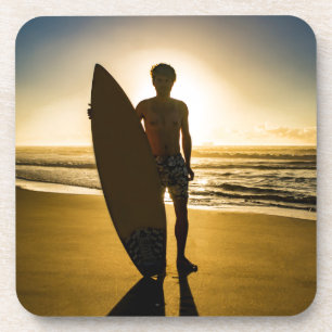 Surfer silhouette during sunrise beverage coaster