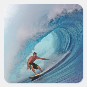 Surfer surfing a huge wave. square sticker